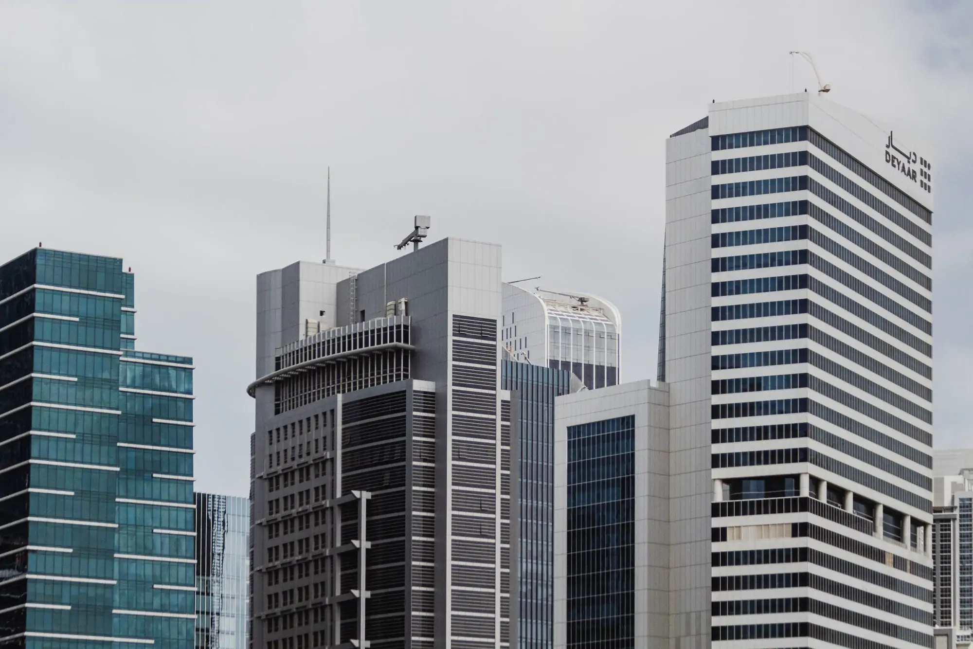 Repeating glass panels of a City office tower under flat grey light